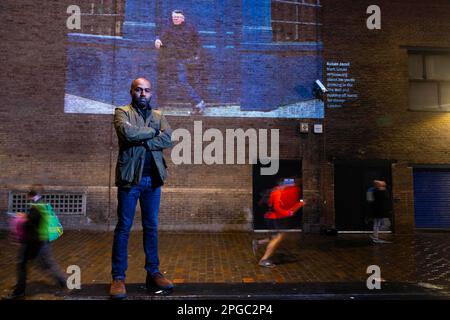 EDITORIAL USE ONLY Photographer Rehan Jamil unveils one of his photo's from Historic England's Picturing High Streets outdoor exhibition is projected outside The Photographers' Gallery in London. Issue date: Wednesday March 22, 2023. Stock Photo