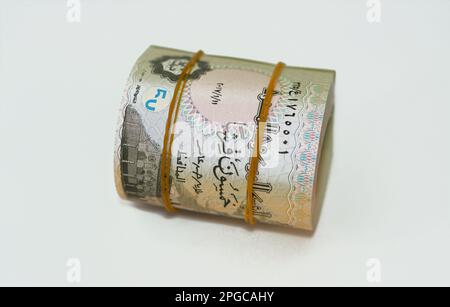 50 Piasters Half EGP LE Egyptian pound cash money bills rolled up with rubber bands with a image of Al Azhar mosque and Ramesses II the second 2nd, Eg Stock Photo