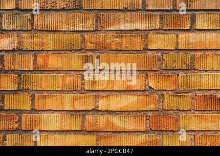 Yellow clinker brick wall texture, detail from streets of Halmstad in Sweden Stock Photo