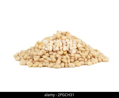 Pile of shelled pine nuts on a white background. Copy space. Stock Photo