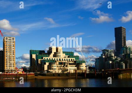 View across River Thames from Millbank to MI6 building and cranes on nearby construction sites, London, England Stock Photo