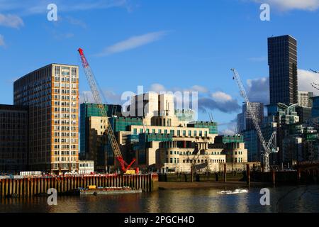 View across River Thames from Millbank to MI6 building and cranes on nearby construction sites, London, England Stock Photo