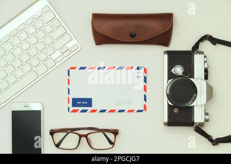 modern minimalist workspace and vintage tool airmail film camera, top view Stock Photo