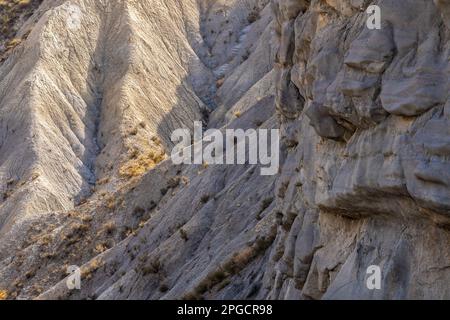 Desert with rough dry uneven surface of rocky cliff in Tabernas desert of Almeria Stock Photo