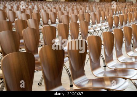 Many modern wooden chairs in Temple of Divine Providence in Warsaw, Wilanów - Poland Stock Photo