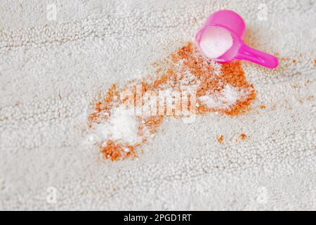 Uses of bleaching powder a white carpet indoors. Cleaning. closeup. daily life stain concept Stock Photo