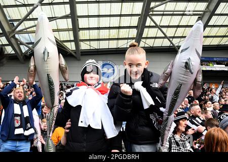 Grimsby Town fans are seen with Harry the Haddock inflatables - Brighton & Hove Albion v Grimsby Town, The Emirates FA Cup Quarter Final, Amex Stadium, Brighton, UK - 19th March 2023  Editorial Use Only - DataCo restrictions apply Stock Photo