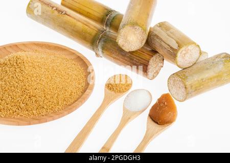 white sugar, brown sugar and sugar cane panela on white background Stock Photo