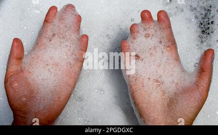 top up view bubble in hand with washing water Stock Photo
