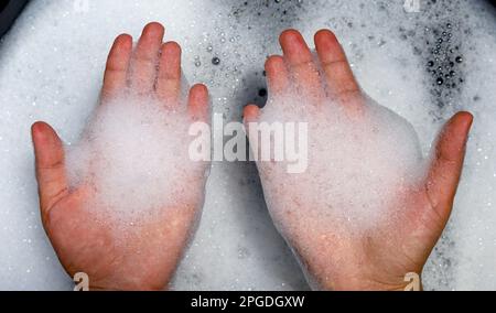 top up view bubble in hand with washing water Stock Photo