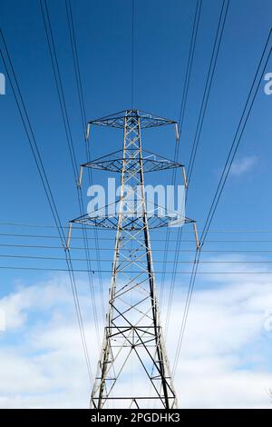 high voltage electricity wires on transmission tower crossing over telephone wires in rural area of Newtownabbey, Northern Ireland, UK Stock Photo