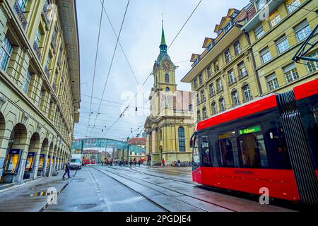 BERN, SWITZERLAND - MARCH 31, 2022: Modern tram rides along Spitalgasse street to Bubenbergplatz in Altstadt district, on March 31 in Bern, Switzerlan Stock Photo