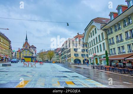 BERN, SWITZERLAND - MARCH 31, 2022: Waisenhausplatz square with historic buildings, Altstadt district, on March 31 in Bern, Switzerland Stock Photo