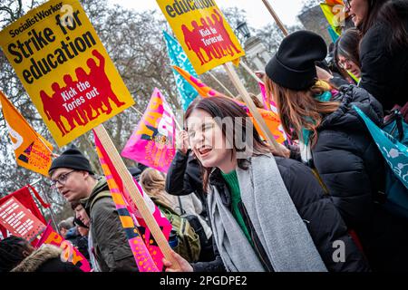 London, UK. 15th March, 2023. Young female shouting. Teachers and children at the start of the biggest protest since the strikes began. The Budget Day protest in central London. Thousands marched through the streets towards Trafalgar Square including teachers, junior doctors, and civil servants all striking for better pay and better working conditions. In total approx. half a million public sector workers across the country walked out over pay. Stock Photo