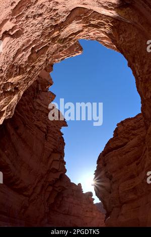 View of sky through rocks, Upper Cathedral Wash below the Vermilion Cliffs National Monument, Glen Canyon Recreation Area, Marble Canyon, Arizona, USA Stock Photo