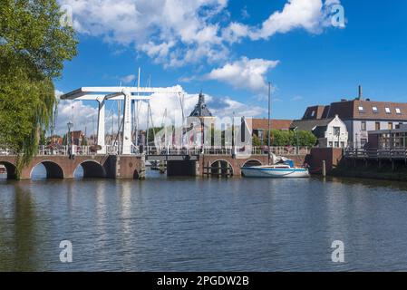 Drawbridge on the Spoorstraat at the Old Port, in the background the former defense tower Dromedaris, Enkhuizen, North Holland, Netherlands, Europe Stock Photo