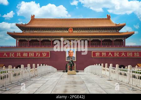 Beijing, China: Tiananmen square, entrance to Forbidden City. A Chinese soldier stands at attention with a portrait of Mao Zedong behind Stock Photo
