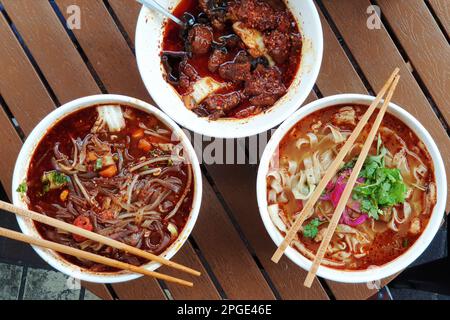 The most famous Chinese dish from Shaanxi province called biang biang noodles alternatively known as youpo chemian served with spicy chily oil chicken Stock Photo