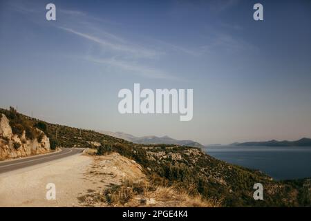 Mountain road over the abyss near Orebic in Croatia. Stock Photo