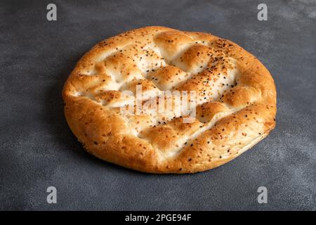 Traditional Ramadan pita on black background.Holy bread for Muslims Stock Photo