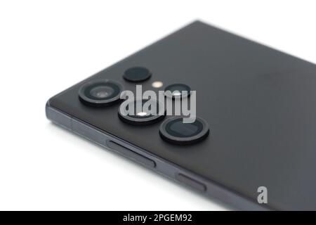 Close up of the camera lenses on a phantom black Samsung Galaxy S23 Ultra flagship Android smartphone on white background Stock Photo