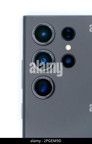 Close up of the camera lenses on a phantom black Samsung Galaxy S23 Ultra flagship Android smartphone on white background Stock Photo