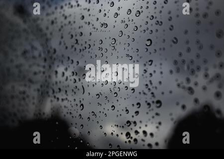 A dramatic view of a window with raindrops on the glass Stock Photo