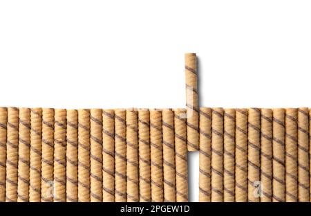 Crispy wafer rolls on a white background with space for text top view. Conceptual composition of waffles on isolation. One is not like everyone else. Stock Photo