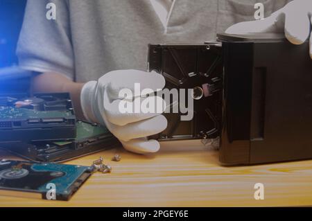 side view Technician installing hard drive Stock Photo