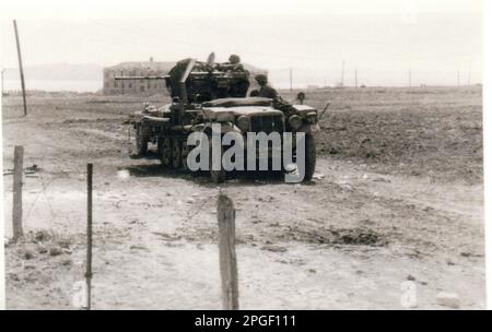 World War Two B&W photo A German Half Track with a 20mm Anti Aircraft Gun in a Ground Attack operation .. The crew are members of the 5th SS Division Wiking on the Southern Front near Kerch Stock Photo