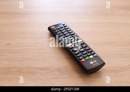 tv remote control on wooden table Stock Photo