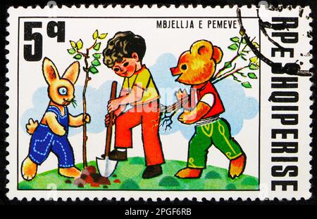 MOSCOW, RUSSIA - MARCH 16, 2023: Postage stamp printed in Albania shows The planting of Trees, 25th anniversary of the Puppet Theater, Fairy Tales ser Stock Photo
