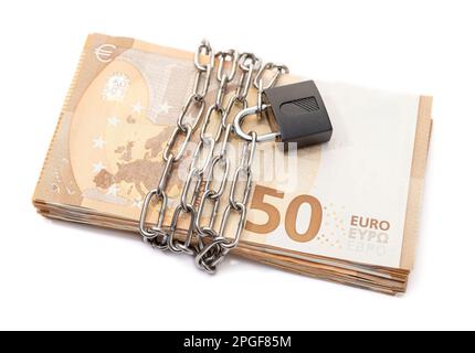 Lock security and chain on euro stack banknotes isolated on white background. Monetary crisis, financial problems, default concept Stock Photo