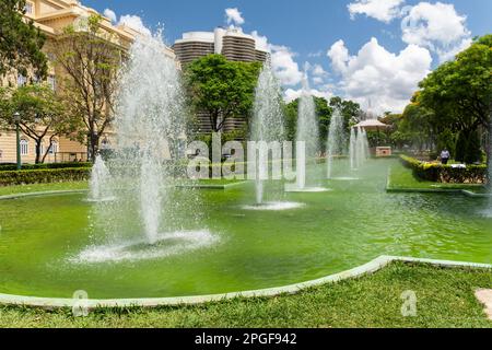 Beautiful view to water fountain and gazebo on green public park Stock Photo