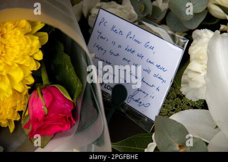London, UK. 22nd March 2023. People pay tribute to Keith David Palmer GM, a Metropolitan Police officer who lost his life protecting Parliament from a terrorist attack six years ago. Palmer was posthumously awarded the George Medal for his bravery in the line of duty. Credit: Sinai Noor/Alamy Live News Stock Photo