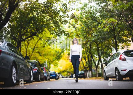 Fashion Girl Walking on the Street Stock Photo