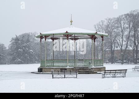 The bandstand in Pump Room Gardens Leamington Spa in a blizzard with heavy snow. Stock Photo