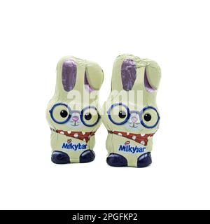 Irvine, Scotland, UK-March 20, 2023: Nestle branded white chocolate Easter themed bunnies covered in foil that is recyclable and displaying the Nestle Stock Photo
