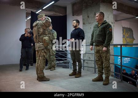 Kharkiv, Ukraine. 22nd Mar, 2023. Ukrainian President Volodymyr Zelenskyy, left, awards a state medal to a soldier during a visit to frontline positions in the Kharkiv region, March 22, 2023 in Kharkiv, Kharkiv Oblast, Ukraine. Credit: Pool Photo/Ukrainian Presidential Press Office/Alamy Live News Stock Photo