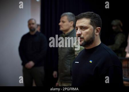 Kharkiv, Ukraine. 22nd Mar, 2023. Ukrainian President Volodymyr Zelenskyy, right, delivers remarks to soldiers during a visit to frontline positions in the Kharkiv region, March 22, 2023 in Kharkiv, Kharkiv Oblast, Ukraine. Credit: Pool Photo/Ukrainian Presidential Press Office/Alamy Live News Stock Photo