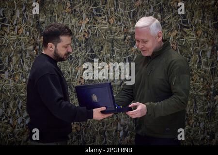 Kharkiv, Ukraine. 22nd Mar, 2023. Ukrainian President Volodymyr Zelenskyy, left, awards Kharkiv Mayor Ihor Terekhov, right, the honorary award 'Hero City of Ukraine' during a visit to frontline positions in the Kharkiv region, March 22, 2023 in Kharkiv, Kharkiv Oblast, Ukraine. Credit: Pool Photo/Ukrainian Presidential Press Office/Alamy Live News Stock Photo