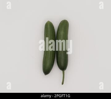 Top of view of two pieces of cucumber isolated on white background. Stock Photo