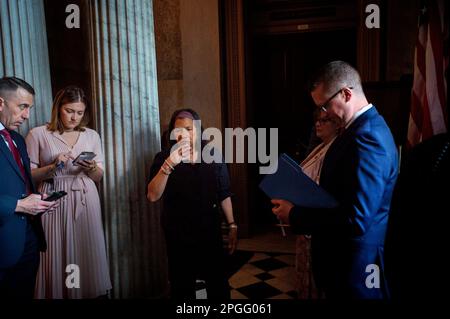 Washington, Vereinigte Staaten. 22nd Mar, 2023. Staffers, reporters and caterers do their work outside of the Senate Republicanâs policy luncheon at the US Capitol in Washington, DC, Wednesday, March 22, 2023. Credit: Rod Lamkey/CNP/dpa/Alamy Live News Stock Photo