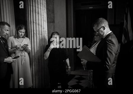 Washington, Vereinigte Staaten. 22nd Mar, 2023. Staffers, reporters and caterers do their work outside of the Senate Republicanâs policy luncheon at the US Capitol in Washington, DC, Wednesday, March 22, 2023. Credit: Rod Lamkey/CNP/dpa/Alamy Live News Stock Photo