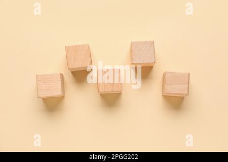 Wooden cubes with check marks on beige background Stock Photo