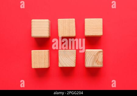 Wooden cubes with check marks on red background Stock Photo