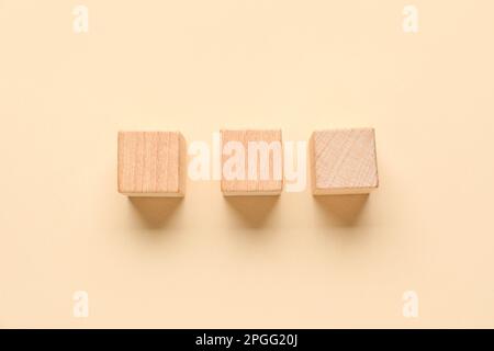 Wooden cubes with check marks on beige background Stock Photo