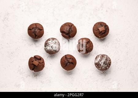Tasty chocolate cupcakes on light background Stock Photo