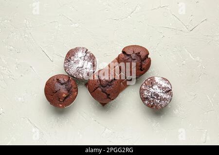 Tasty chocolate cupcakes on light background Stock Photo