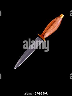 Edged weapon dirk isolated over a black background Stock Photo